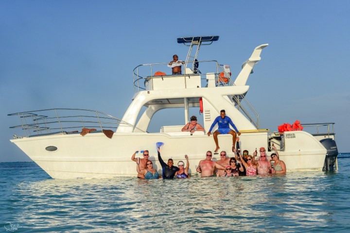 a group of people on a boat in the water